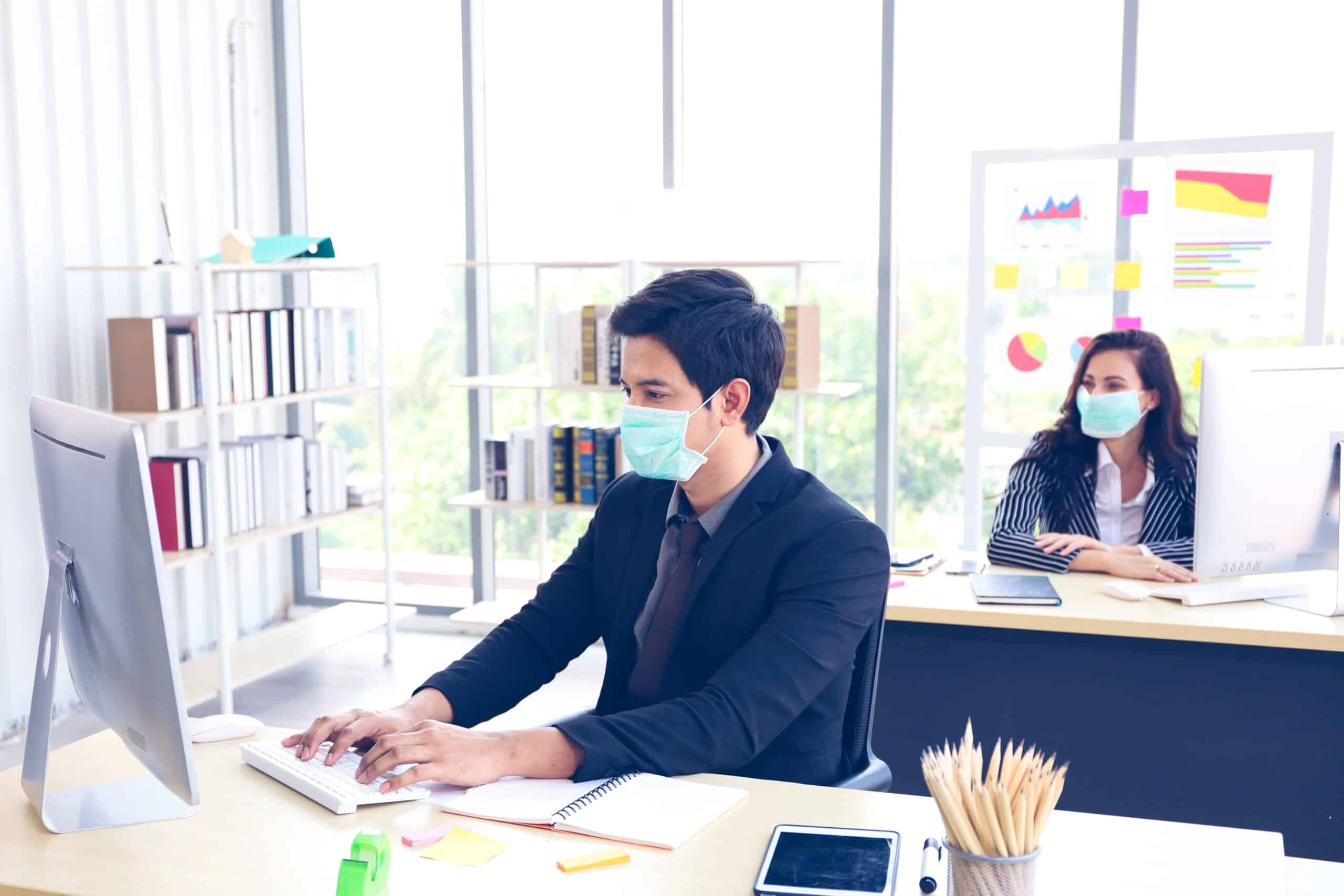 Workers In Office With Graphs Blog2