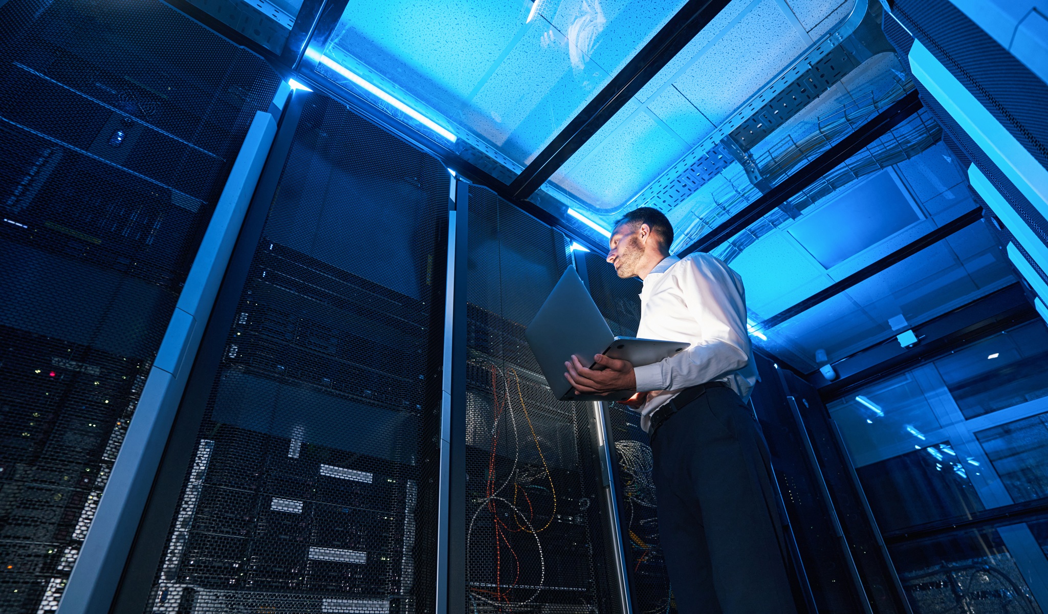 System Administrator Watching Equipment Inside Erver Cabinet System Administrator Watching Equipment Inside Erver Cabinet