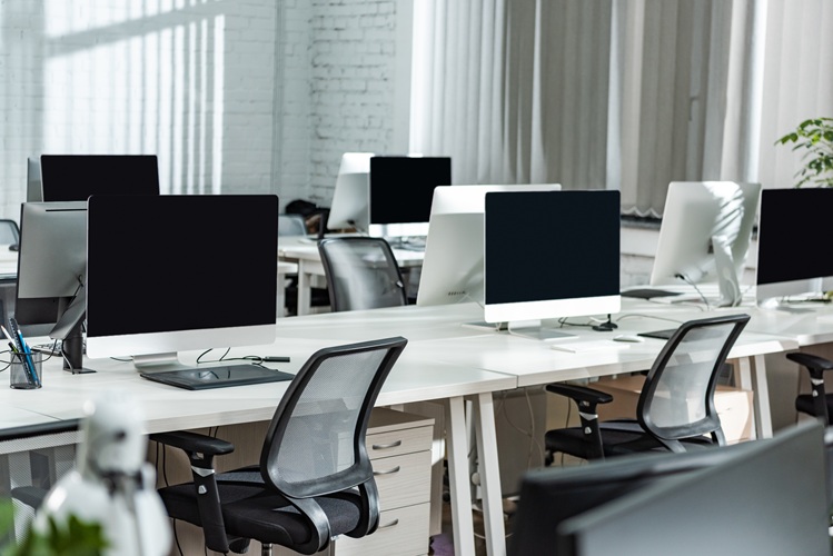 Modern Open Space Office With Computer Monitors On White Desks
