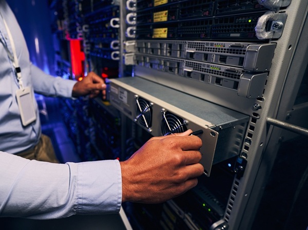 Engineer Carrying Out Data Center Equipment Upgrade