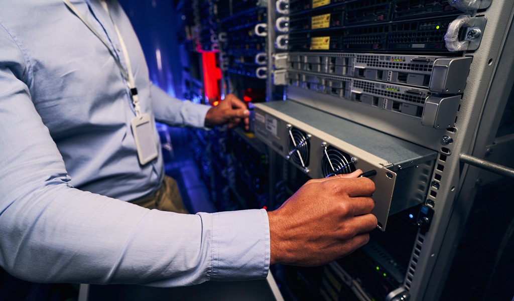 Engineer Carrying Out Data Center Equipment Upgrade